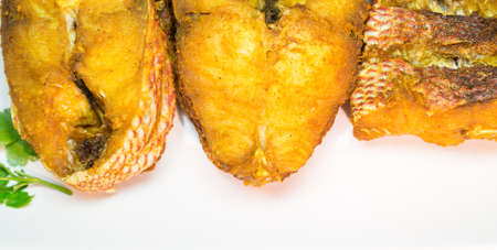 Portions of deep fried red snapper fish の写真素材