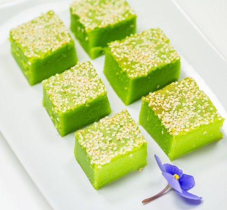 Locally known as Kuih Bakar, a Malaysian sweet delicacy with sesame seeds toppingsの写真素材
