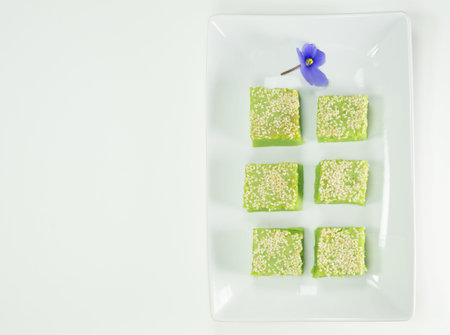 Locally known as Kuih Bakar, a Malaysian sweet delicacy with sesame seeds toppings