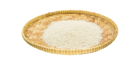 Rice grain in a wicker trayの写真素材