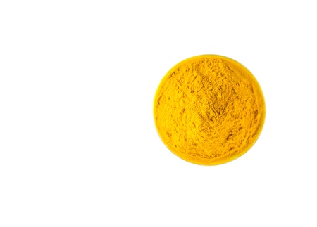 Turmeric powder over white backgroundの写真素材