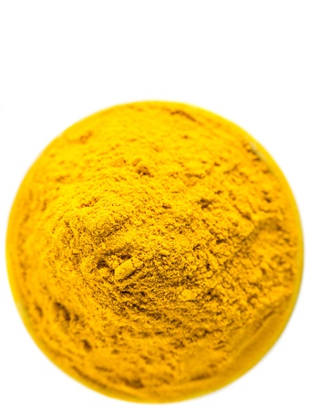 Turmeric powder over white backgroundの写真素材