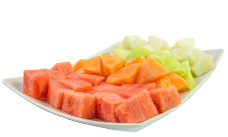 Bite size melons and honeydews over white backgroundの写真素材