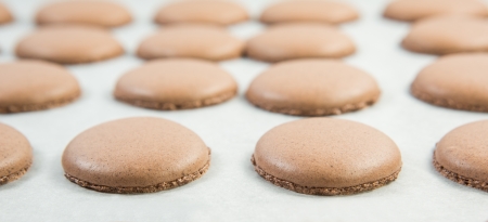 Baking French Macaron chocolate flavored cookiesの写真素材