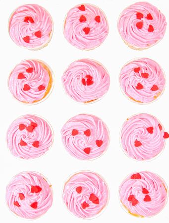 Pink cupcakes over white backgroundの写真素材