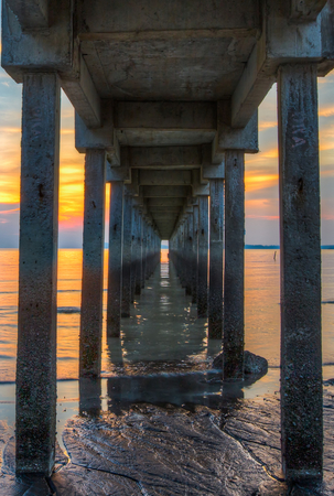 View under a jetty at sunsetの写真素材