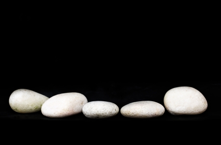 White zen stone over black backgroundの写真素材