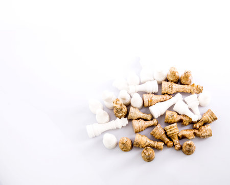 Stone made chess set over white background