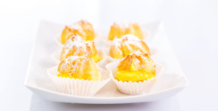 Cream puff over white background