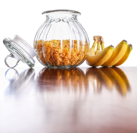 Jar of cereal and banana on a table