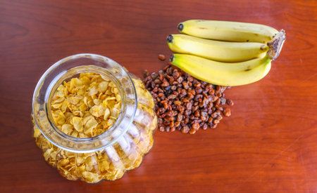 Jar of cereal, raisin and banana on a table