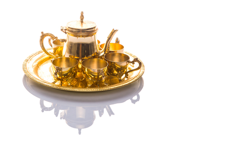 Old Middle Eastern tea set over white backgroundの写真素材