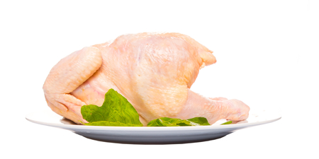 Whole chicken meat over white の写真素材