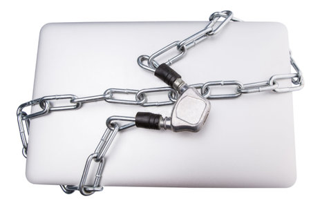 Laptop and chains over white for PC securityの写真素材