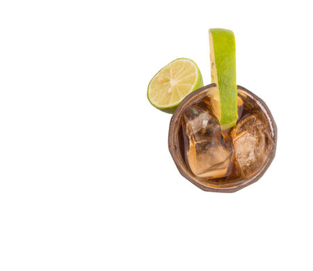 Cola drinks with ice cubes and lime over white backgroundの写真素材