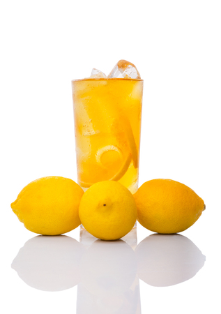 A glass of ice lemon tea over white backgroundの写真素材