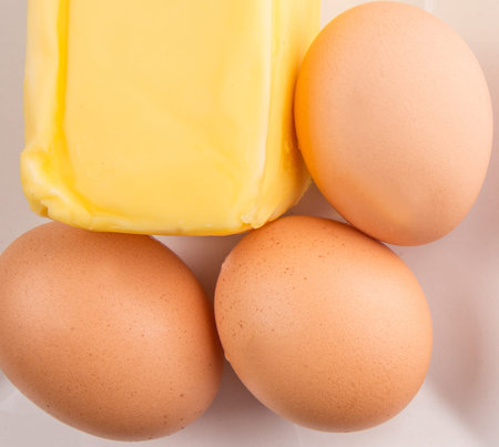 A group of chicken eggs and butterの写真素材