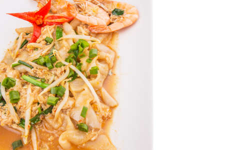 A plate of char kway teow with prawns and gravyの写真素材
