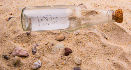 Concept image of a message HOPE in a bottleの写真素材