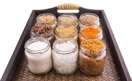 Sugar and spices in a wicker trayの写真素材