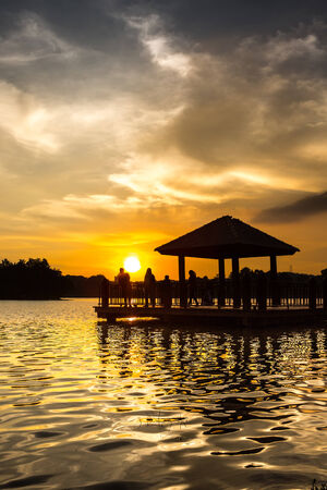 Water gazebo and sunset at a lake in Putrajaya, Malaysiaの写真素材