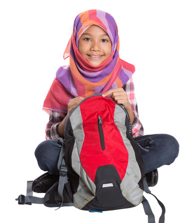 Muslim school girl with backpack over white backgroundの写真素材