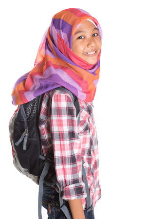 Muslim school girl with backpack over white backgroundの写真素材