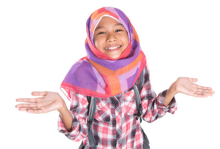 oung Muslim school girl with headscarf and backpackの写真素材