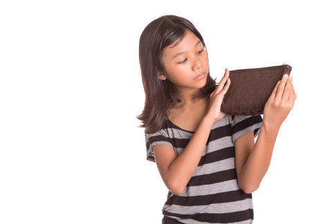 Young Asian Malay girl with purse over white backgroundの写真素材