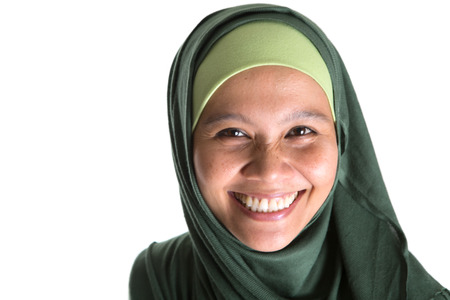 Muslim woman in green hijab over white backgroundの写真素材