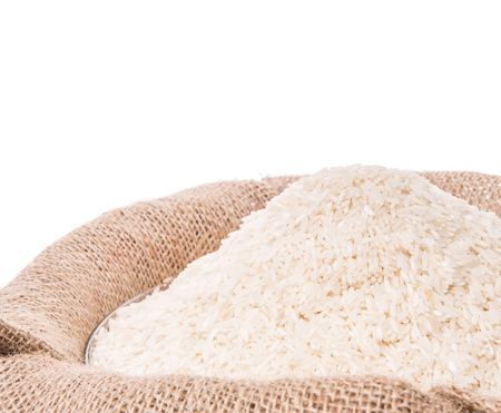 Rice in a gunny sack over white backgroundの写真素材