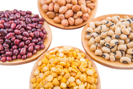 Peanut, dal lentils, black eye bean and adzuki bean on wooden spoon
