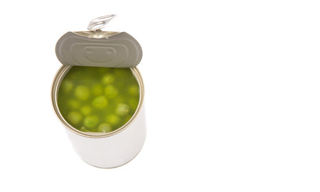 Green peas in a tin can over white backgroundの写真素材