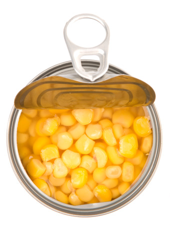 Sweet corn in a tin can over white backgroundの写真素材
