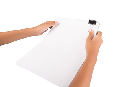 Female hand holding white paper with binder clips over white backgroundの写真素材