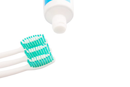 Toothbrush and toothpaste over white backgroundの写真素材