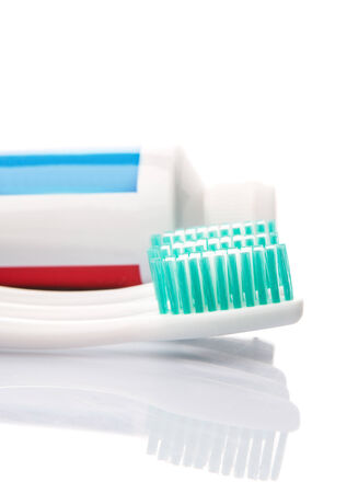Toothbrush and toothpaste over white backgroundの写真素材