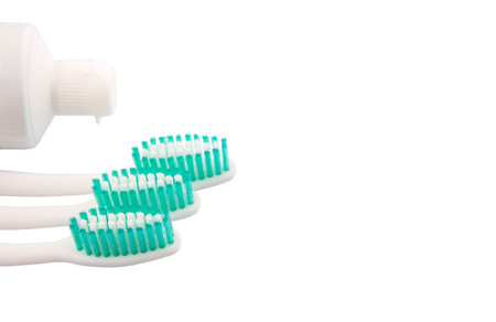Toothbrush and toothpaste over white backgroundの写真素材