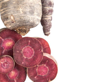 Chopped purple carrot over white backgroundの写真素材