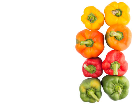 A group of different colors of capsicum over white backgroundの写真素材