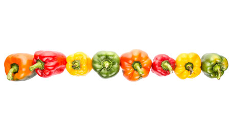 A group of different colors of capsicum over white backgroundの写真素材