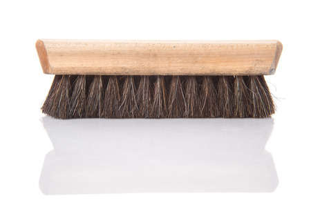 Wooden shoe shine polish brush over white backgroundの写真素材