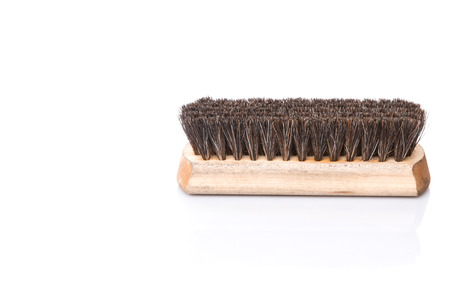 Wooden shoe shine polish brush over white backgroundの写真素材