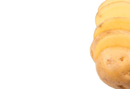 Sliced whole potato over white backgroundの写真素材