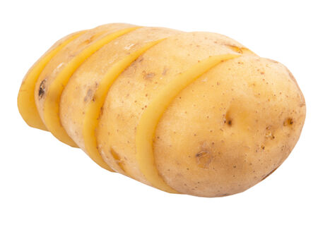 Sliced whole potato over white backgroundの写真素材