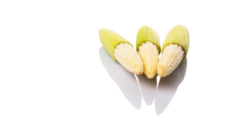 Baby corns over white background