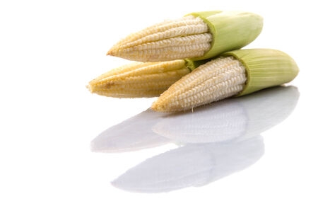 Baby corns over white backgroundの写真素材