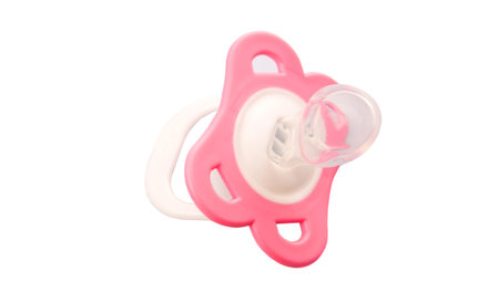 A pink pacifier over white background