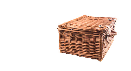Handmade wicker picnic basket over white backgroundの写真素材
