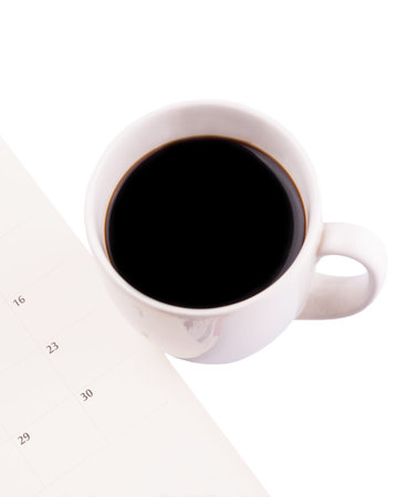 A mug of coffee and table day plannerの写真素材